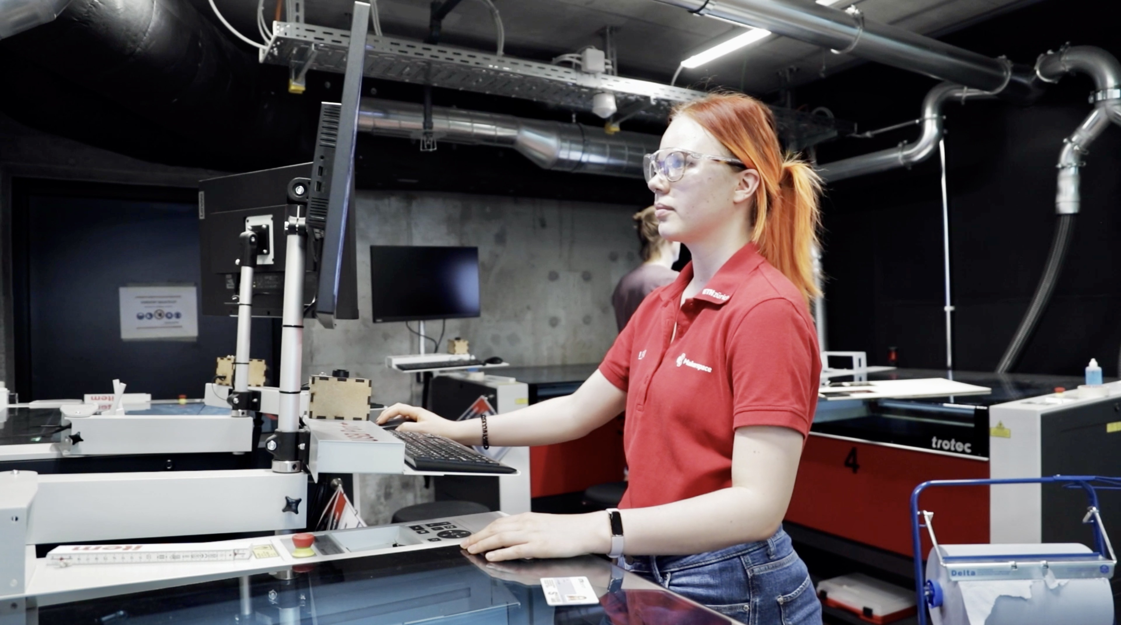 Lenke Kis working with a Laser Cutter